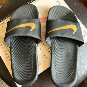 Nike five US size slip on shoes navy blue with gold Nike symbol